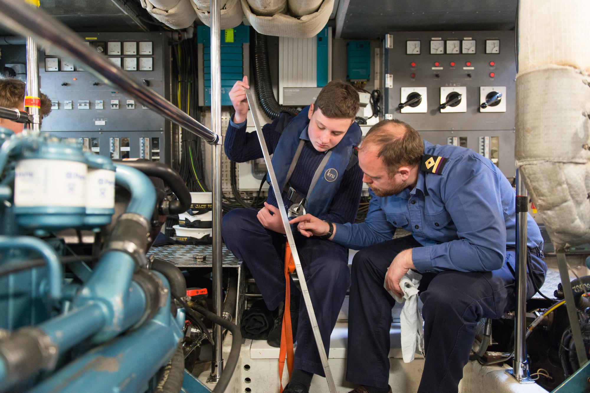 Sea Cadet being trained in practical skills by instructor
